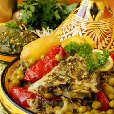 Moroccan fish marinated in Chermoula relish, simmered with new potatoes, peas and tomatoes.